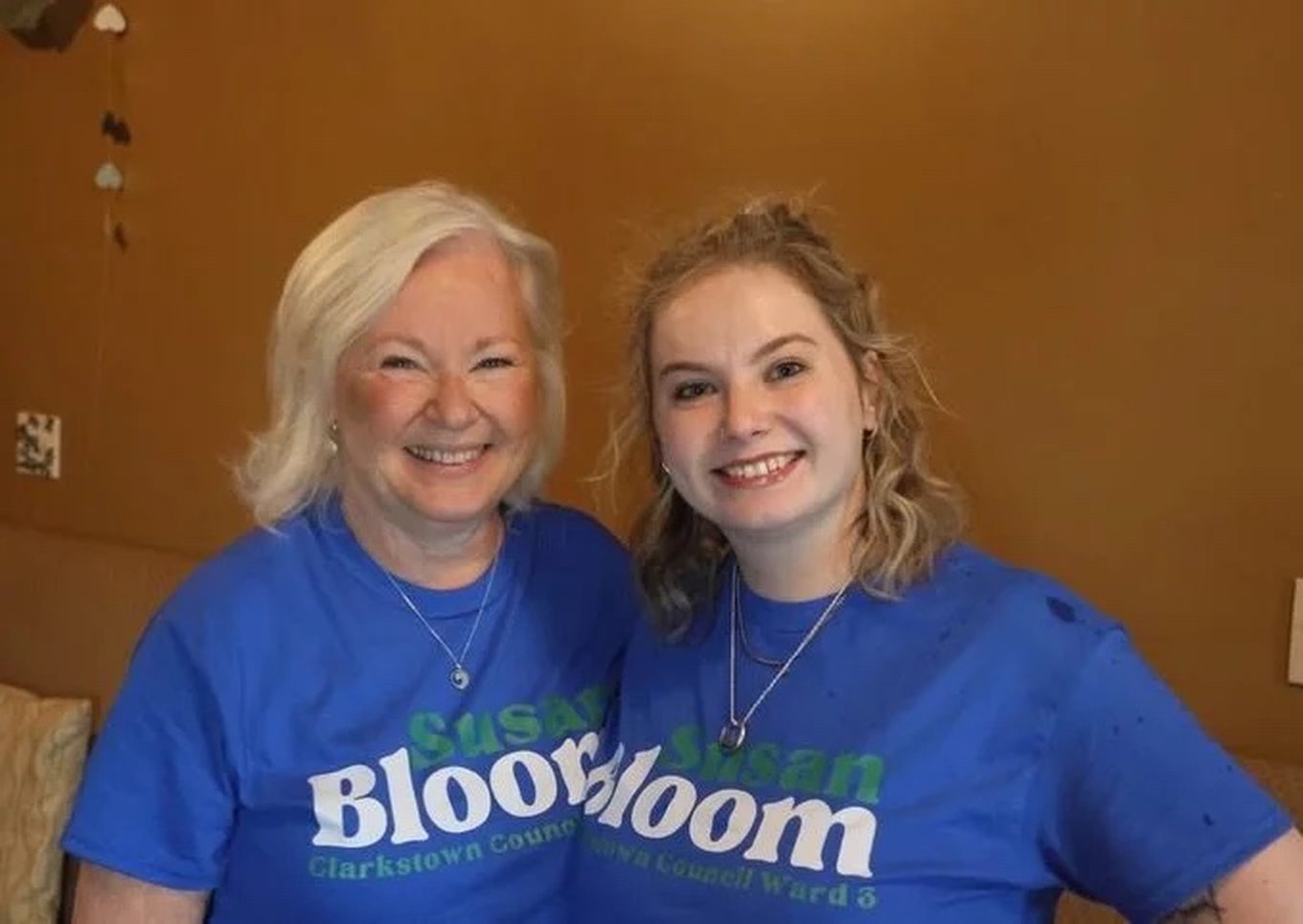 Susan Bloom with her daughter Jenna, both in Susan Bloom campaign t-shirts
